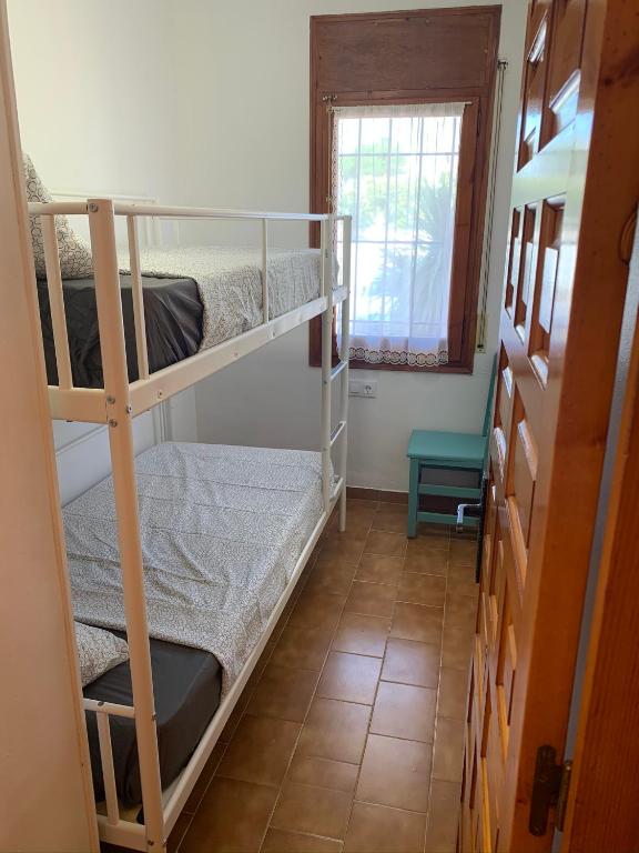 A bed or beds in a room at BADIA BEACH- Empuriabrava