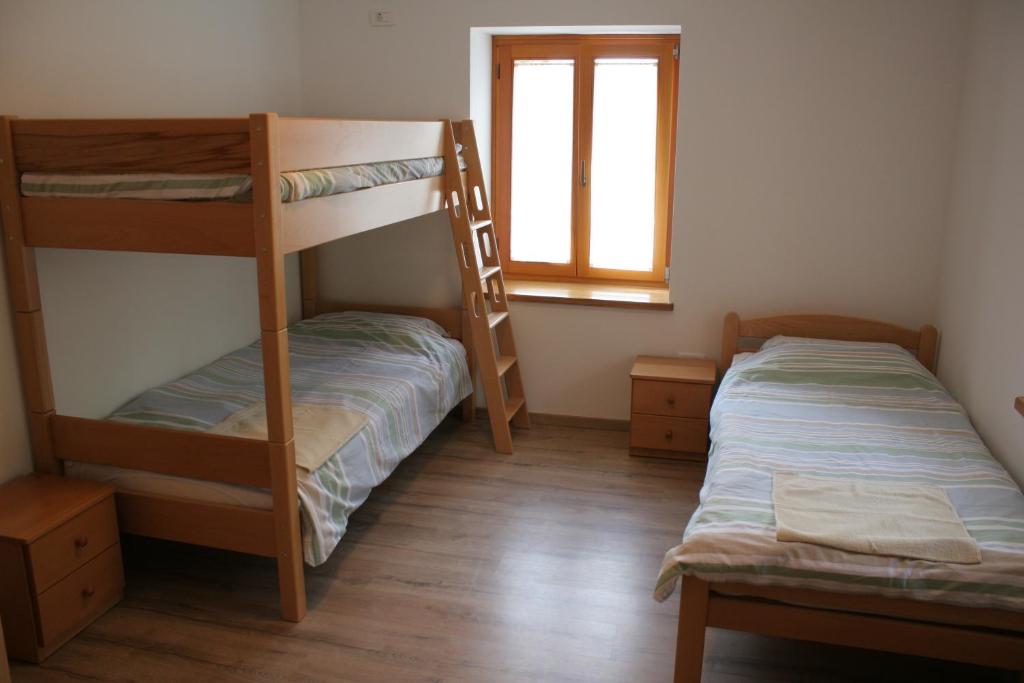 Postel nebo postele na pokoji v ubytování Apartments Jez
