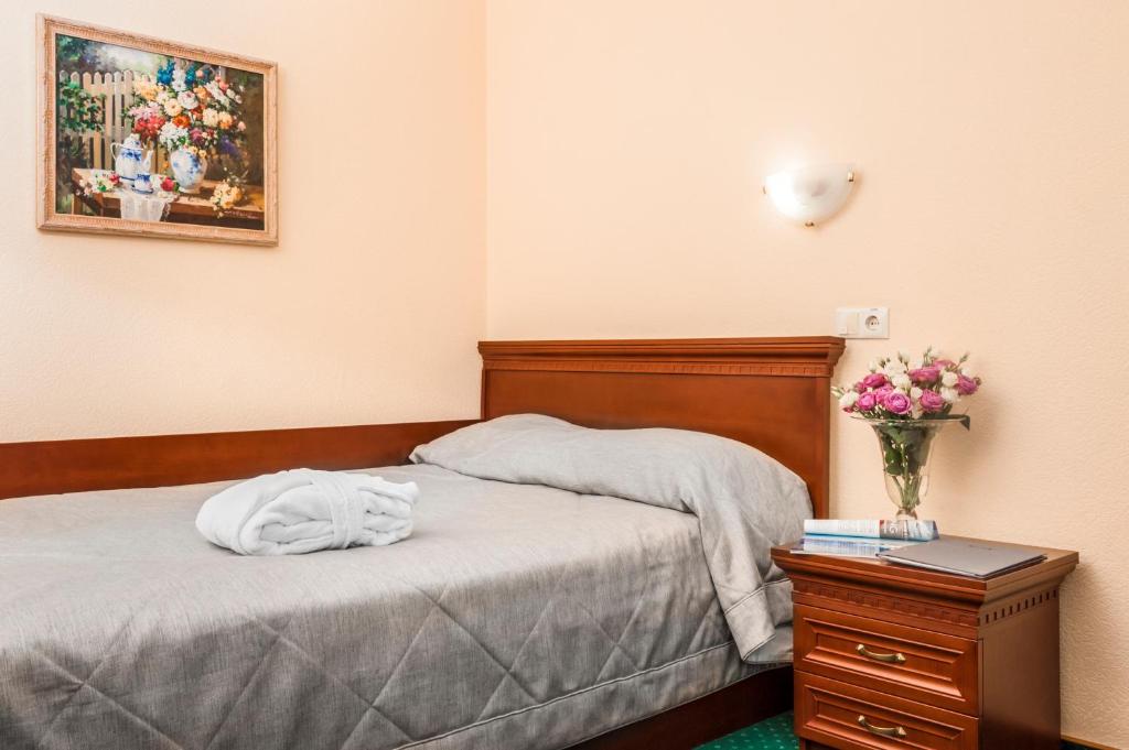 Postel nebo postele na pokoji v ubytování Hotel Kyiv