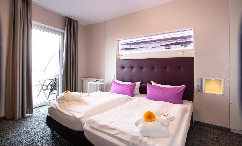 Postel nebo postele na pokoji v ubytování Hotel Fährhaus