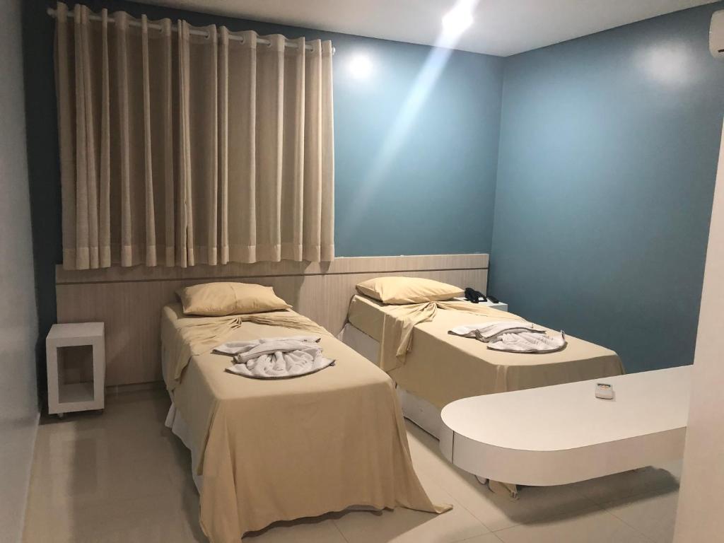Postel nebo postele na pokoji v ubytování Hotel Roni