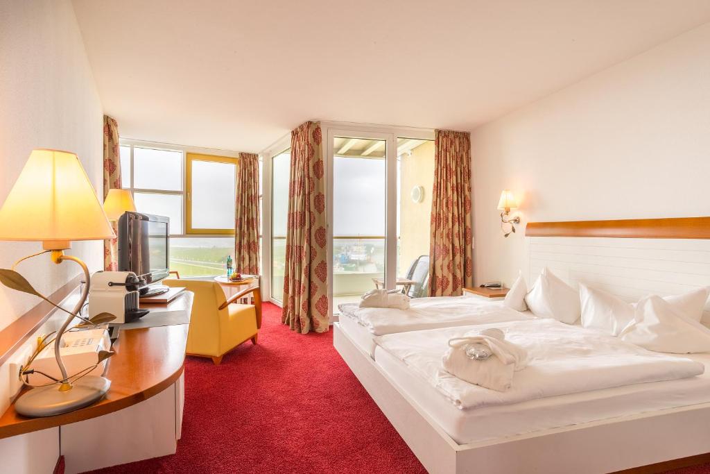 Postel nebo postele na pokoji v ubytování Hotel Fährhaus