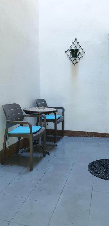 two chairs and a table in a room at Apartment Rafael in Senj