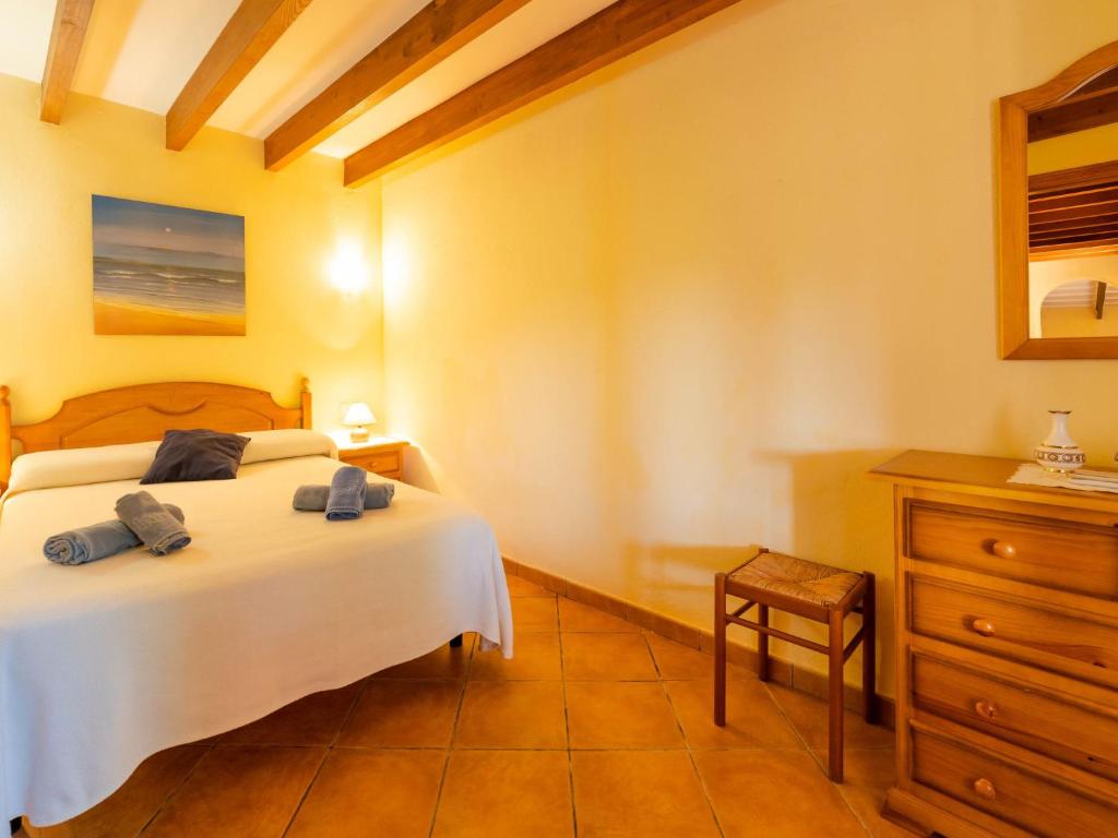 A bed or beds in a room at Holiday Home Can Josepot by Interhome