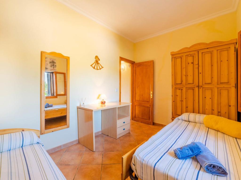 A bed or beds in a room at Holiday Home Can Josepot by Interhome