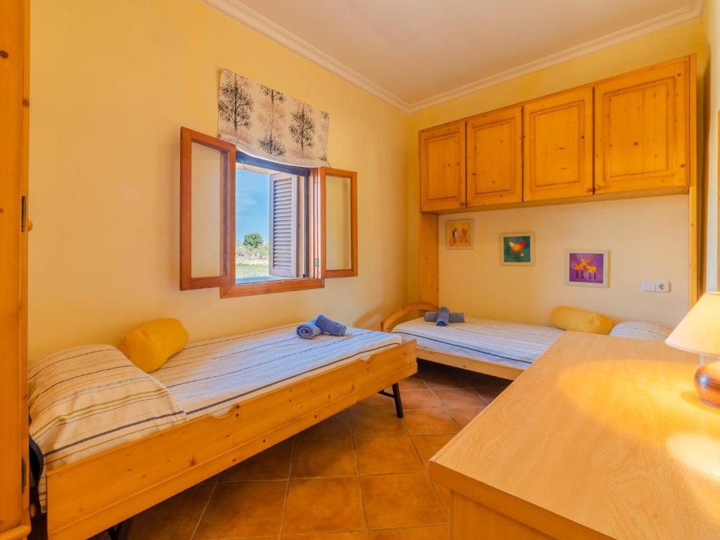 A bed or beds in a room at Holiday Home Can Josepot by Interhome