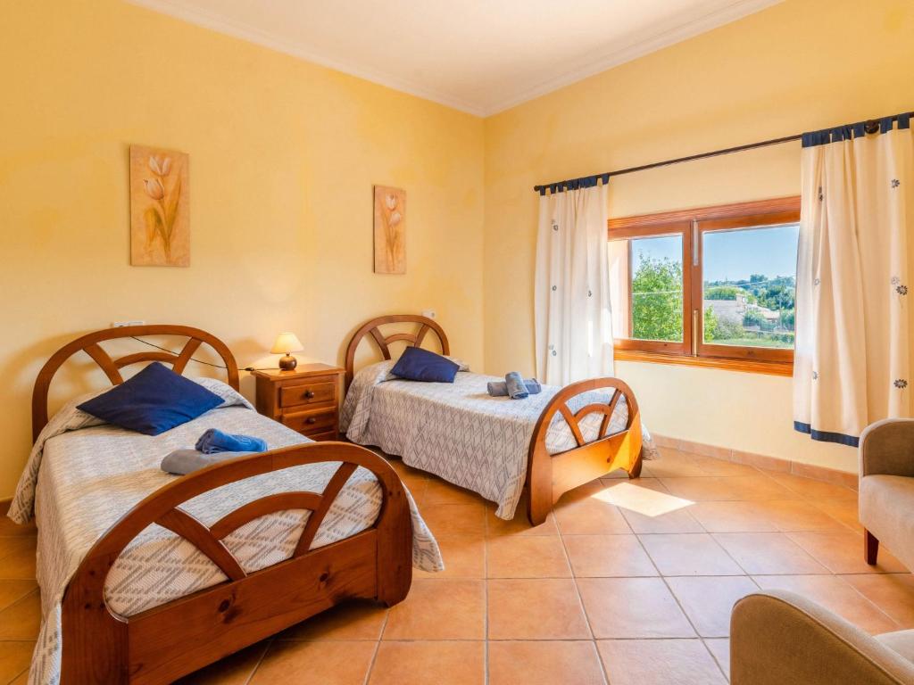 A bed or beds in a room at Holiday Home Can Josepot by Interhome