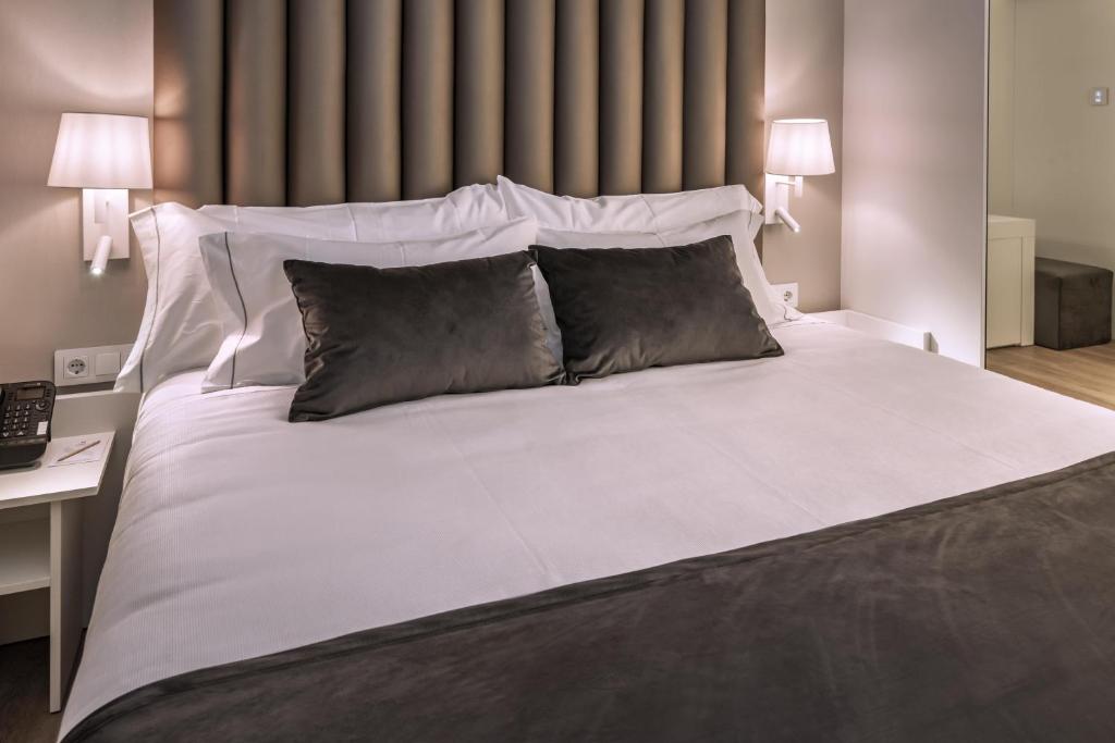 Postel nebo postele na pokoji v ubytování Hotel Playafels