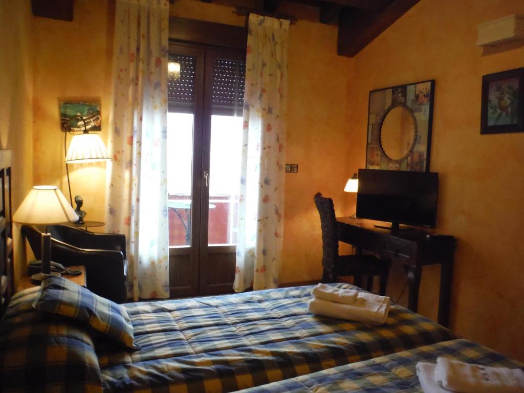 Cama o camas de una habitación en Complejo Rural El Marañal
