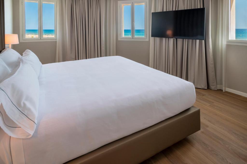 Postel nebo postele na pokoji v ubytování Hotel Playafels