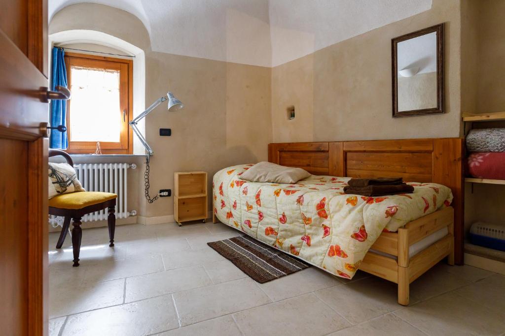 Posteľ alebo postele v izbe v ubytovaní Arvé Castelbianco - B&B e Appartamento