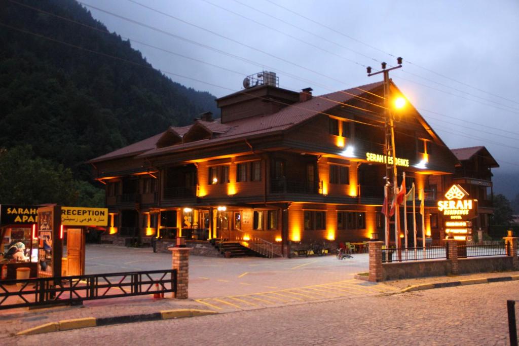 a large building with a street light in front of it at ŞERAH APART otel in Uzungöl