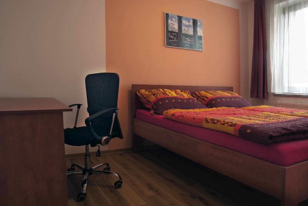 Postel nebo postele na pokoji v ubytování Penzion U Vinotéky