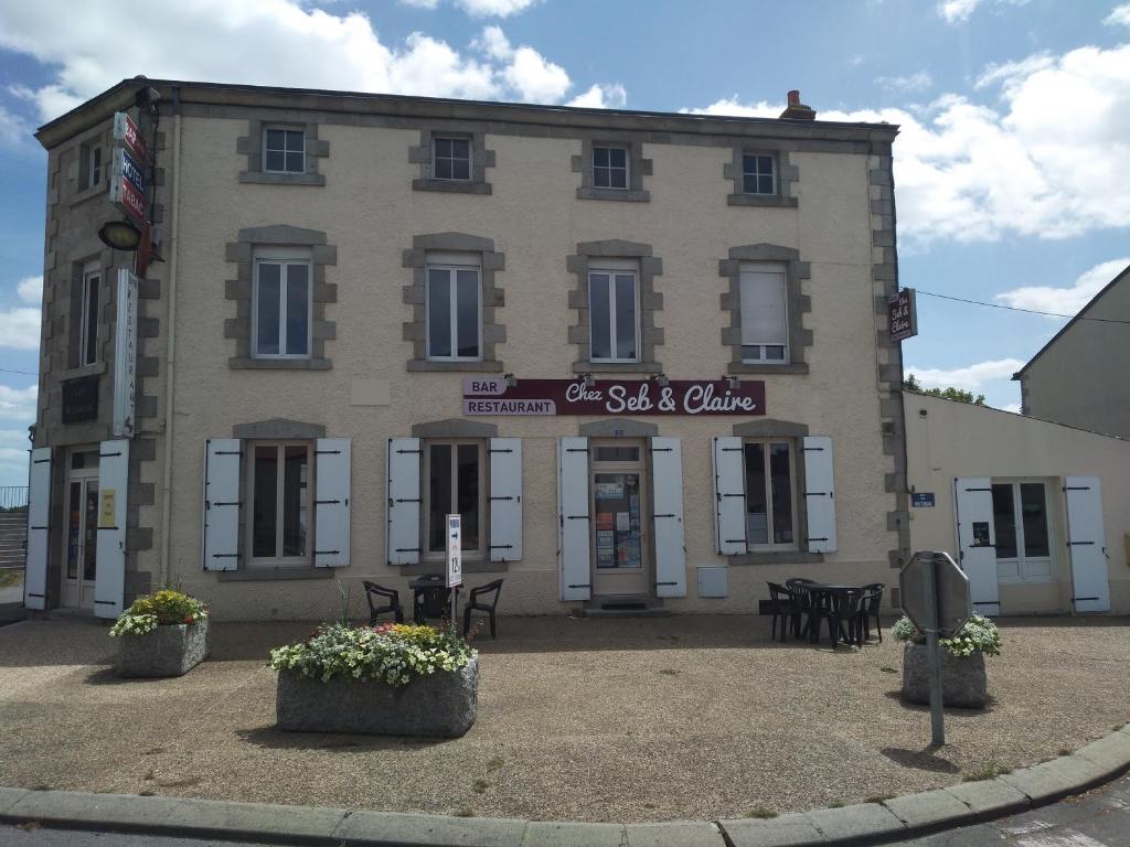 a building with a sign on the front of it at Chez Seb & Claire in Rorthais