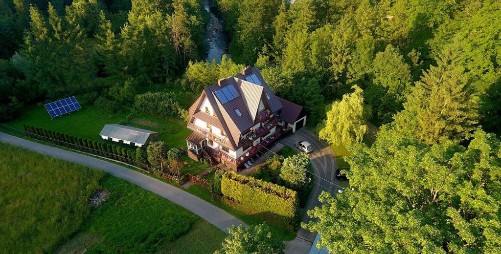 an aerial view of a house in the middle of a forest at MARYSIEŃKA in Zawoja