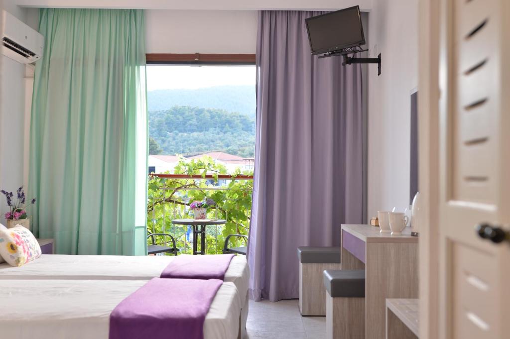 Postel nebo postele na pokoji v ubytování Elsa Hotel