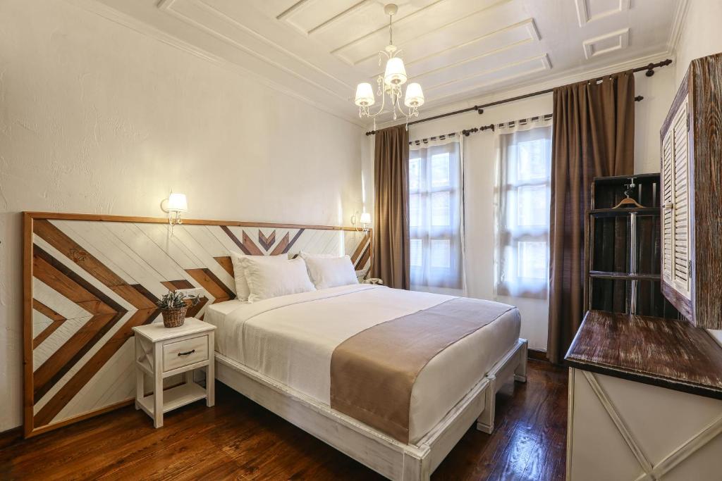 Ένα ή περισσότερα κρεβάτια σε δωμάτιο στο Trilye Bay C Konak
