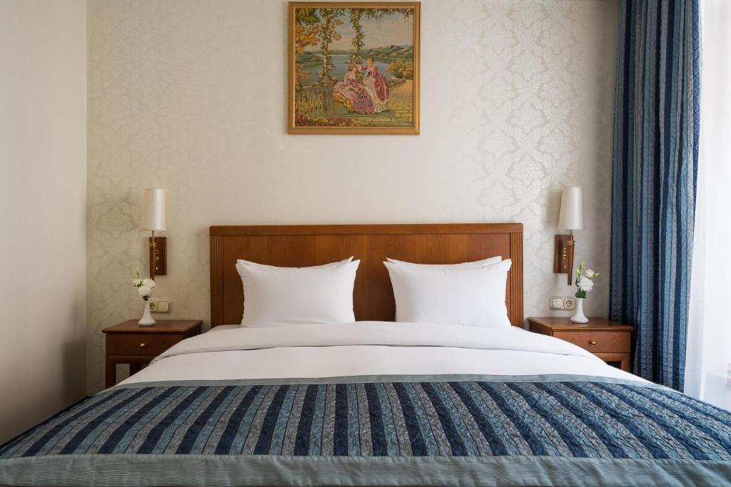 Postel nebo postele na pokoji v ubytování Mozart Hotel