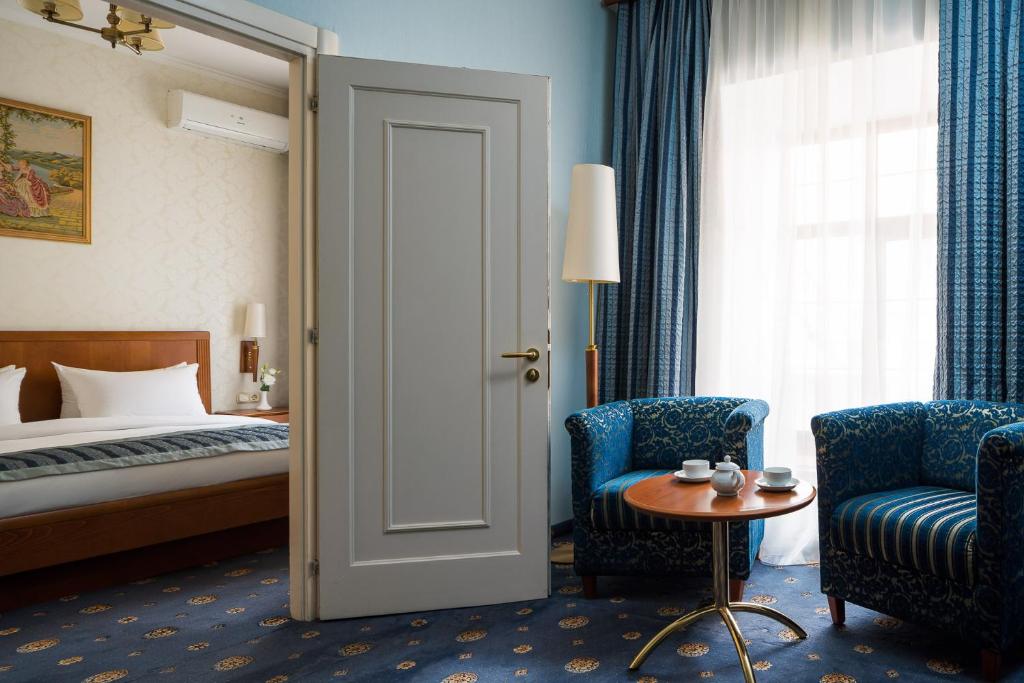 Postel nebo postele na pokoji v ubytování Mozart Hotel