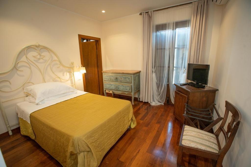 A bed or beds in a room at Agriturismo Le Anfore