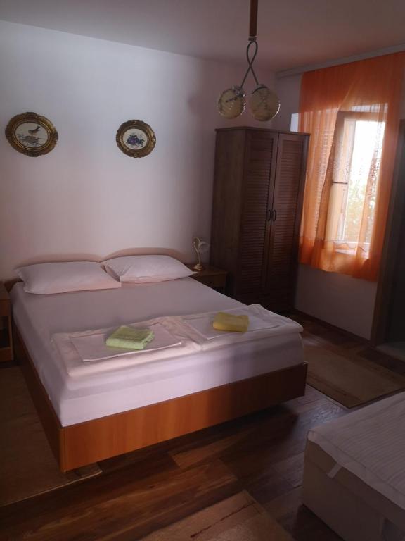 Postel nebo postele na pokoji v ubytování Apartment Dada