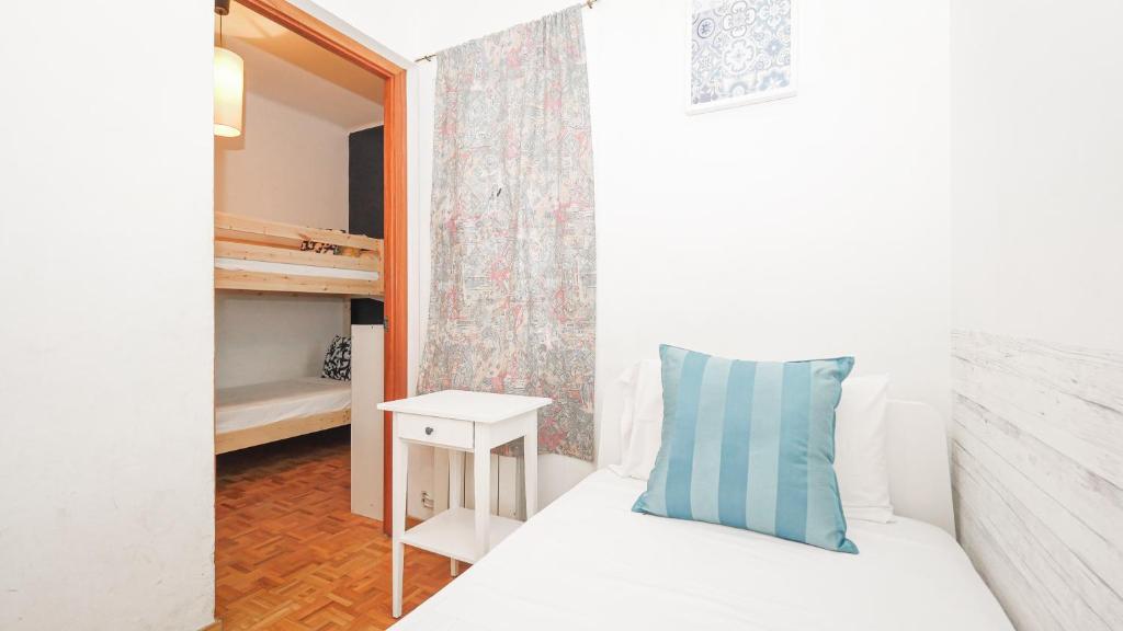 Postel nebo postele na pokoji v ubytování Bed&Bcn Sant Andreu