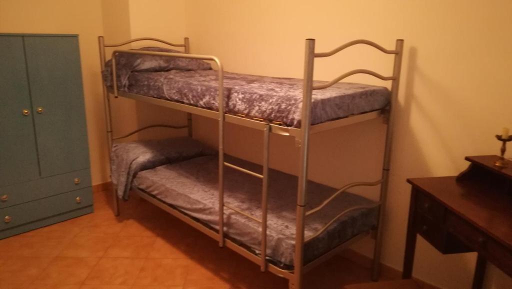 Postel nebo postele na pokoji v ubytování IL BUSSETO