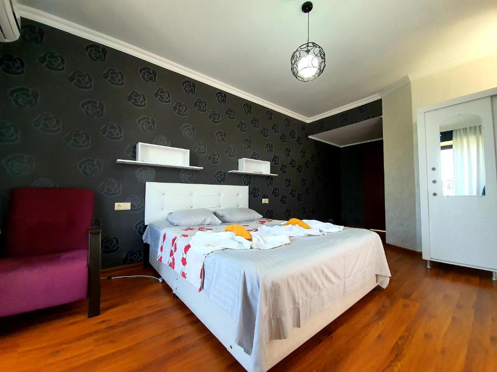 Postel nebo postele na pokoji v ubytování Sunrise Hotel