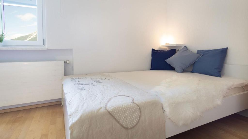 Posteľ alebo postele v izbe v ubytovaní Alpen Loft