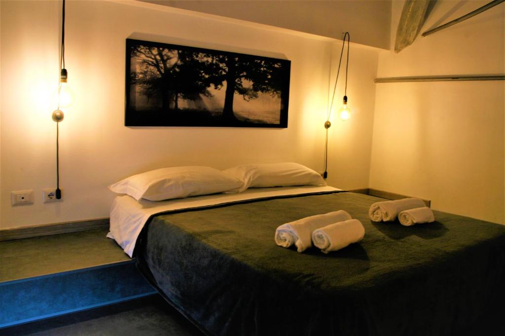 Krevet ili kreveti u jedinici u okviru objekta Re di Roma loft