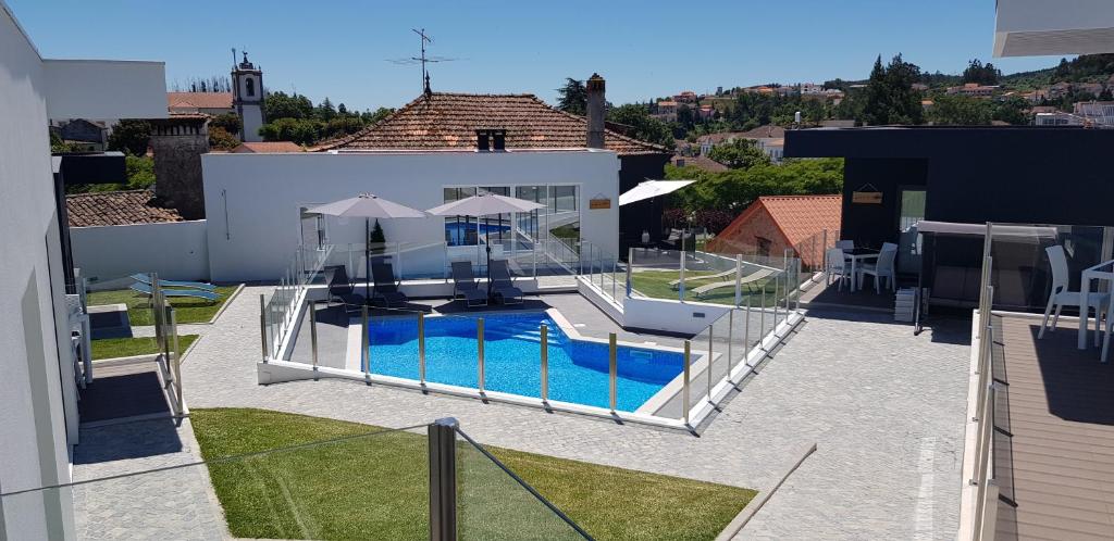 a view of a house with a swimming pool at Artvilla Tourism Houses in Castanheira de Pêra