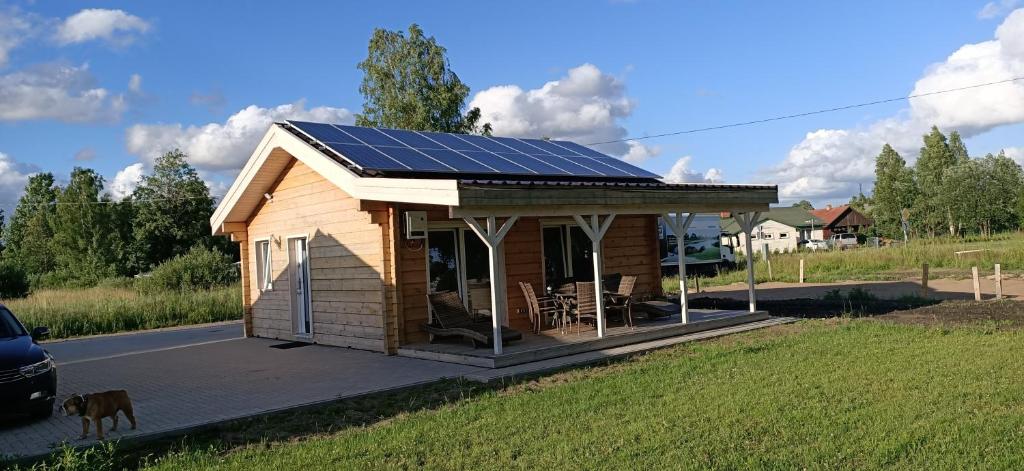 a tiny house with solar panels on it at Kuldigas Holiday House in Kuldīga