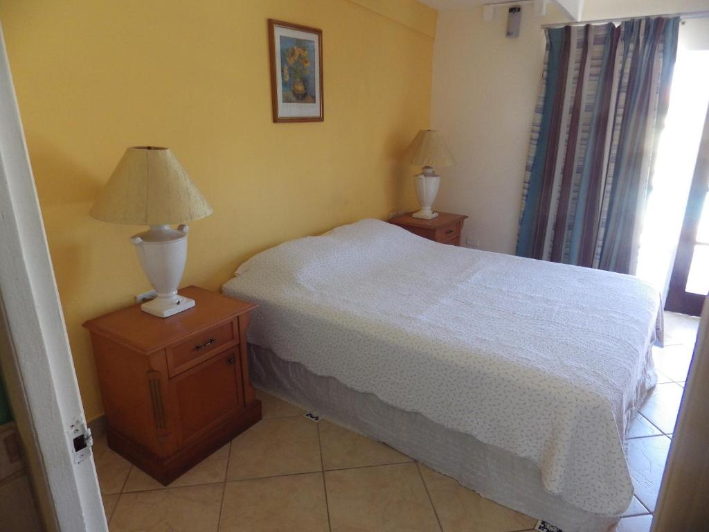 Cama ou camas em um quarto em Aruba Cunucu Residence