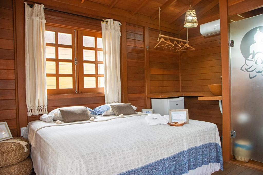Postel nebo postele na pokoji v ubytování Pousada Villa del Lótus