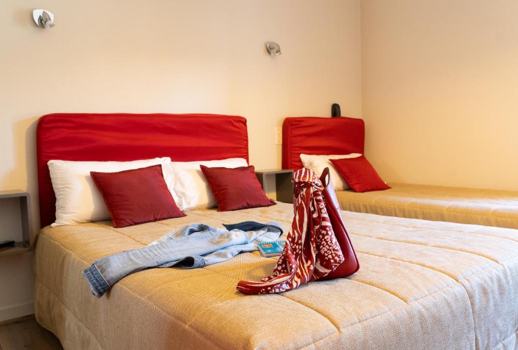 Postel nebo postele na pokoji v ubytování Hôtel Juantorena