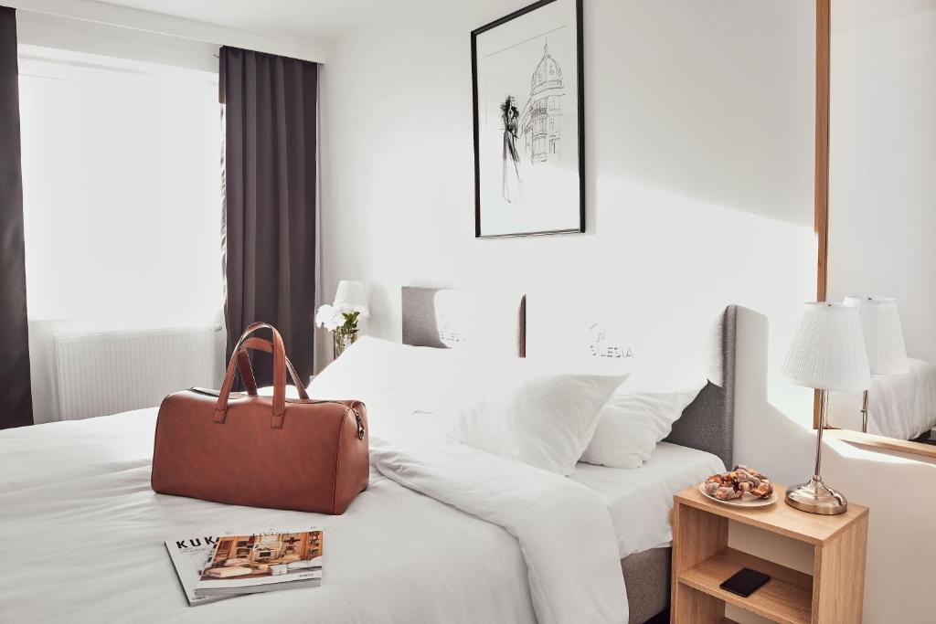Posteľ alebo postele v izbe v ubytovaní Silesia Apartments