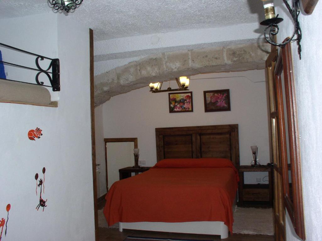 Postel nebo postele na pokoji v ubytování La Cueva de Juan Pedro