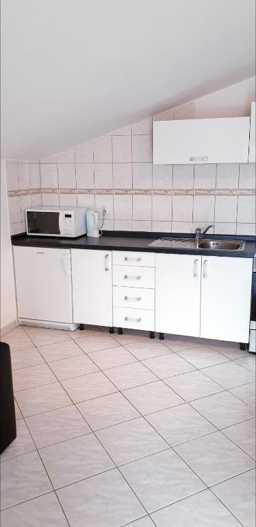 Kuchyň nebo kuchyňský kout v ubytování Apartment Antonio