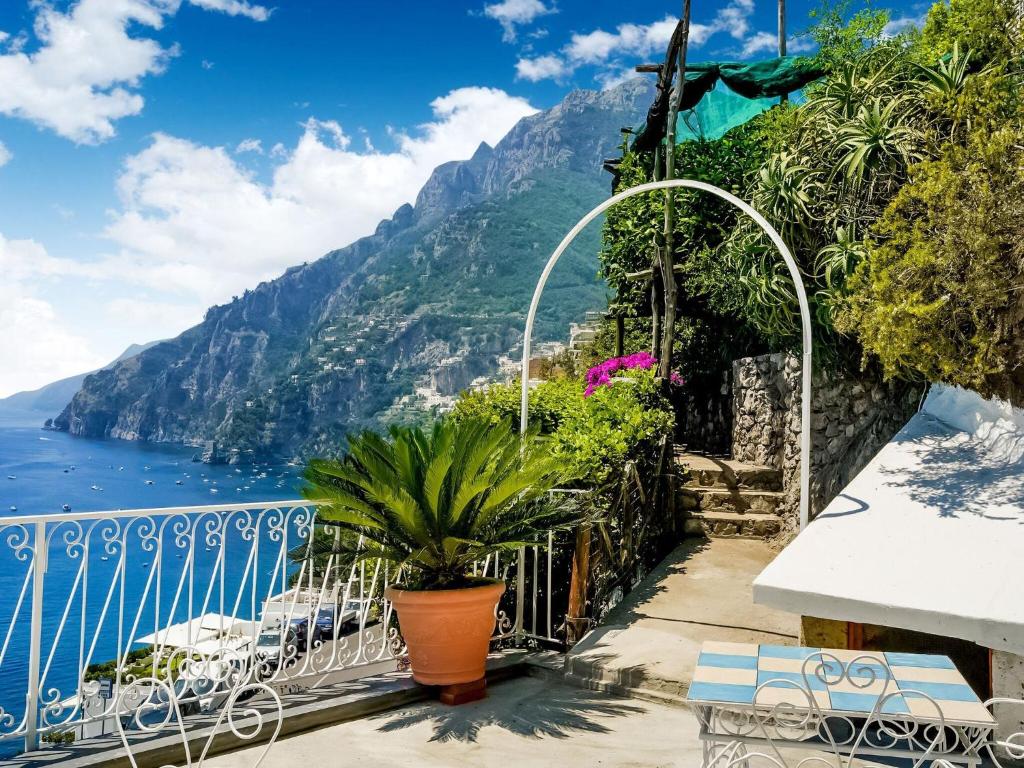 a balcony with a view of the amalfi coast at Belvilla by OYO Arienzo in Positano
