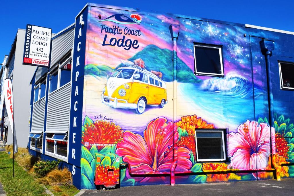 a mural of a van on the side of a building at Pacific Coast Lodge and Backpackers in Mount Maunganui
