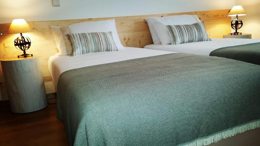 Postel nebo postele na pokoji v ubytování ESSENCYAHOMECoimbra