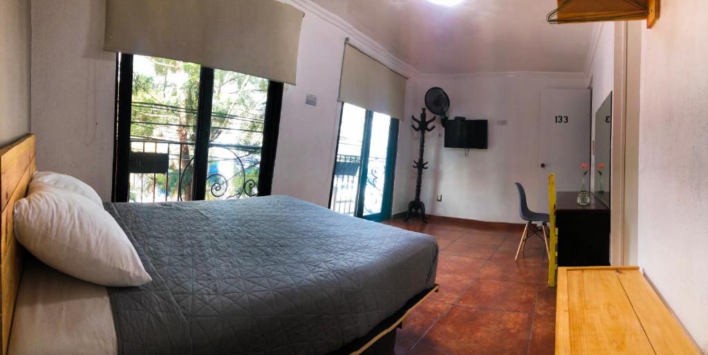 Postel nebo postele na pokoji v ubytování Hotel Tecnologico