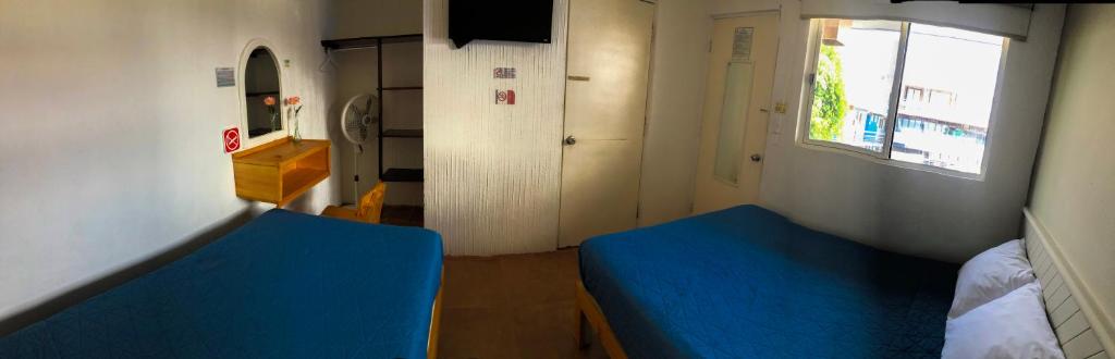 Postel nebo postele na pokoji v ubytování Hotel Tecnologico