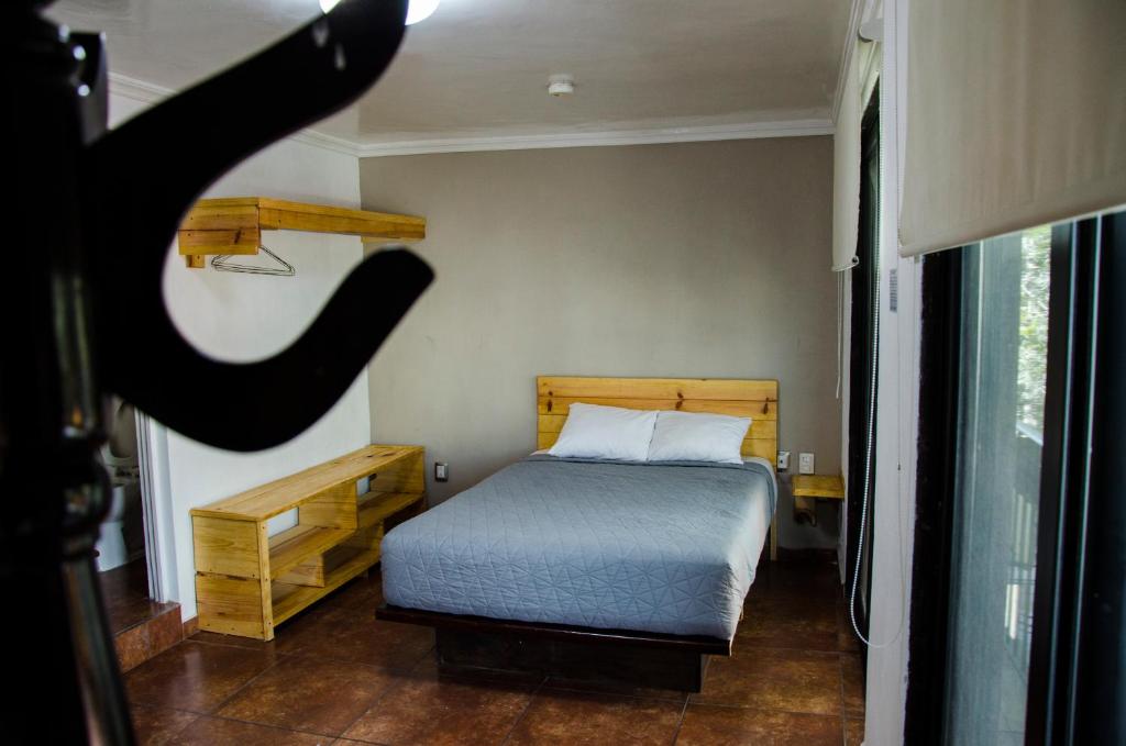 Postel nebo postele na pokoji v ubytování Hotel Tecnologico