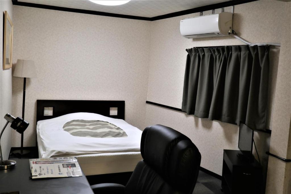 Postel nebo postele na pokoji v ubytování Hotel Daiki
