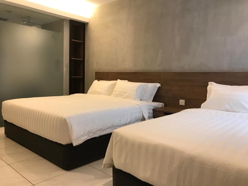 Postel nebo postele na pokoji v ubytování Dandelion Inn