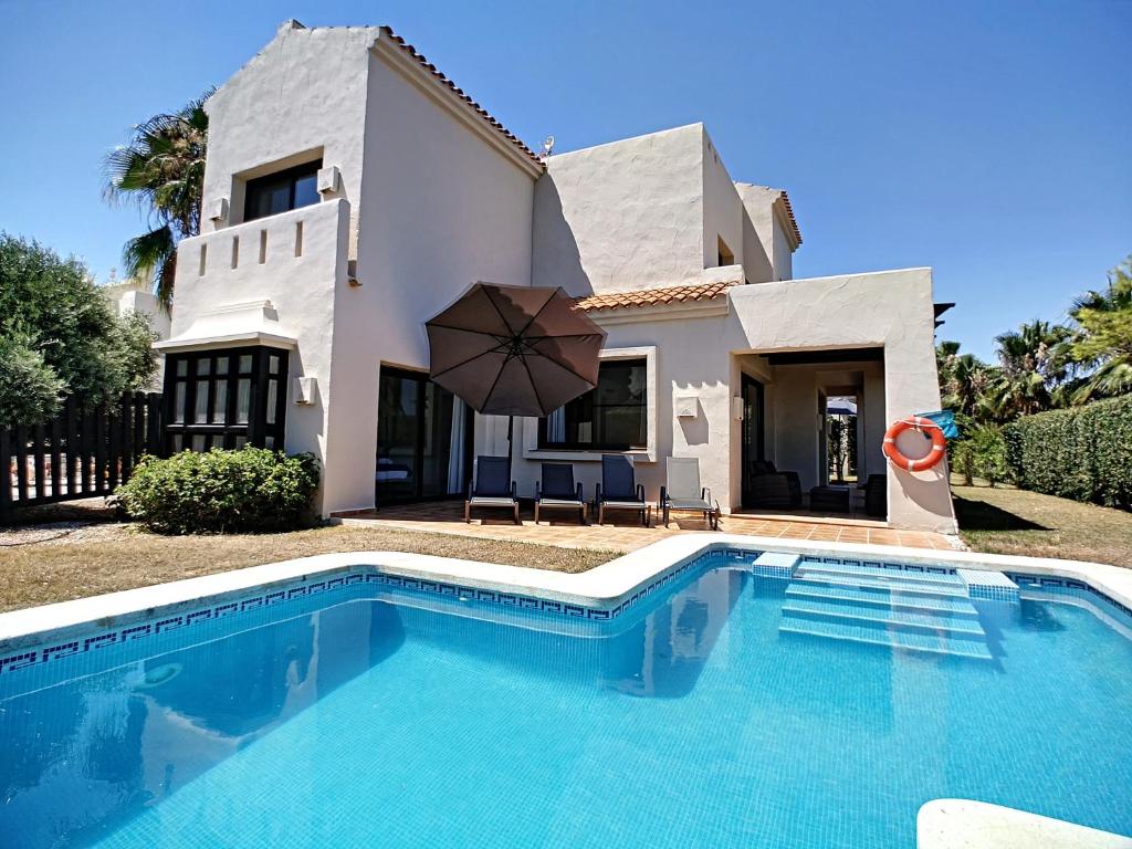 a villa with a swimming pool in front of a house at Roda Villa with Pool 0508 in San Javier