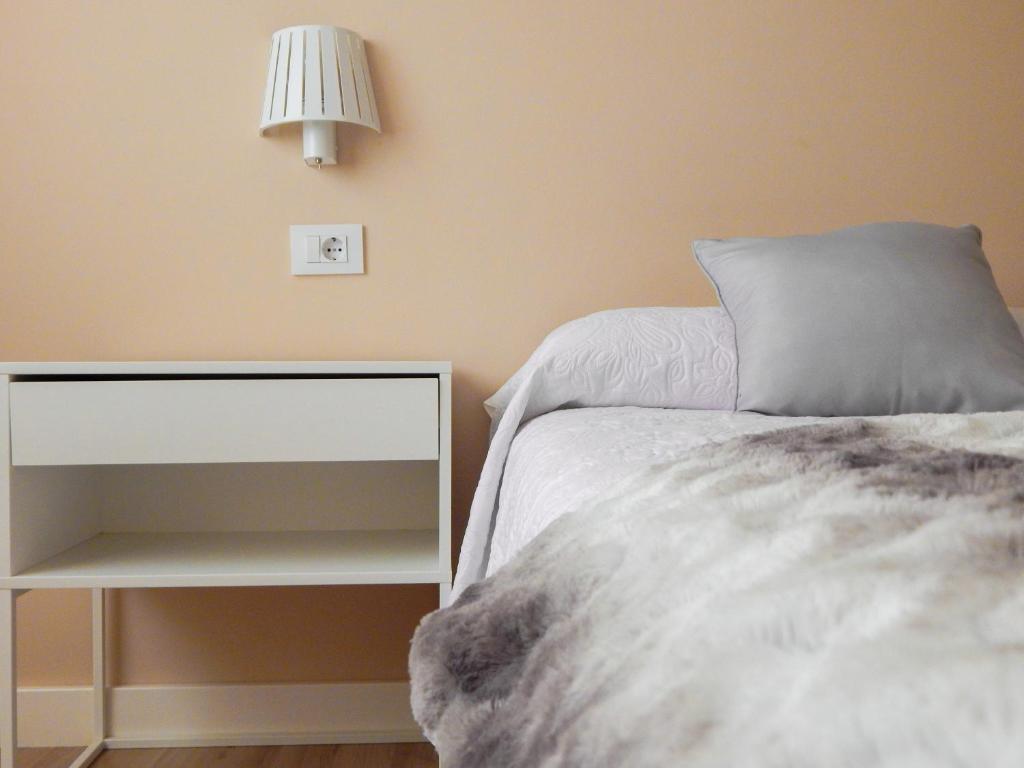 Łóżko lub łóżka w pokoju w obiekcie CORAL HOME