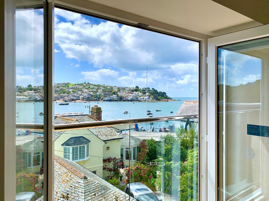 a view of a harbor from a window in a house at The Old Bakery in Fowey