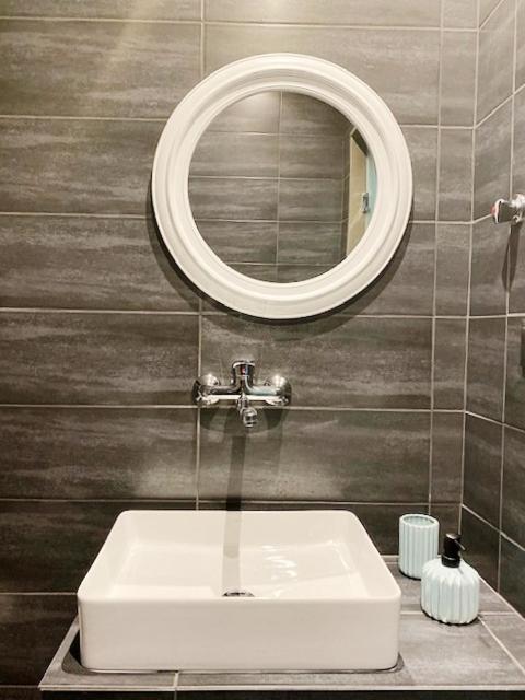 Koupelna v ubytování Xenios Hotel